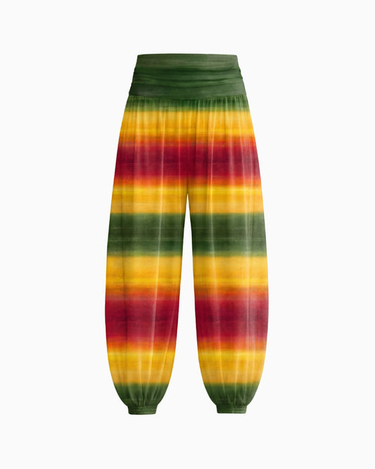 Calça Aladdin Tule Ginga solta em degradê verde, amarelo e vermelho, cintura franzida e barra com punho elástico